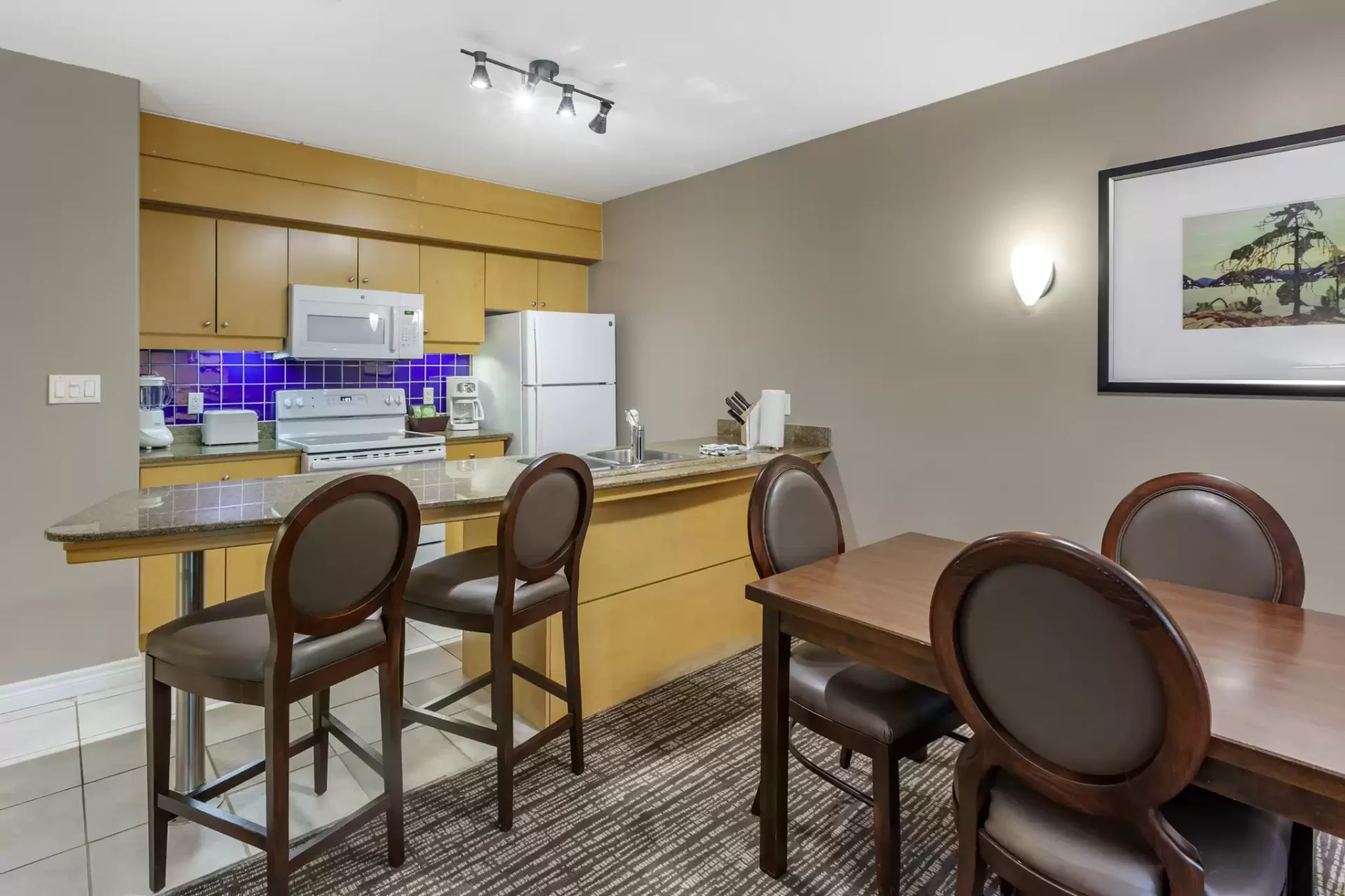 Carriage Ridge Resort One queen bed suite with living room and kitchenette